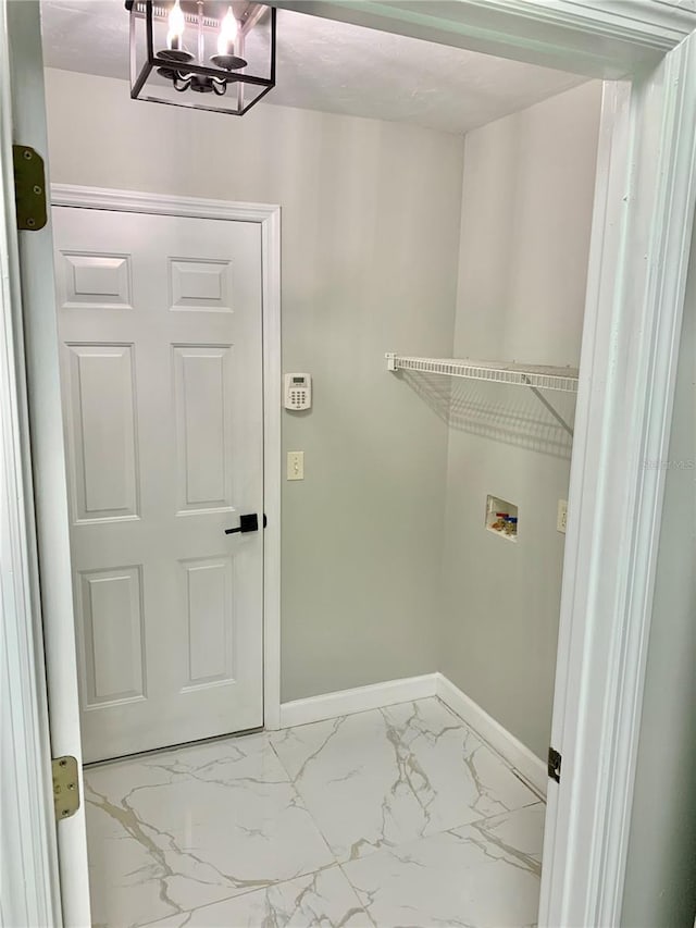 washroom featuring marble finish floor, hookup for a washing machine, laundry area, and baseboards