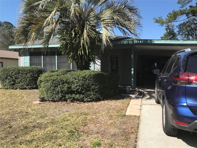 view of property exterior with a carport