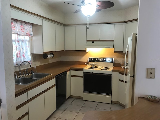 kitchen with range with electric stovetop, freestanding refrigerator, a sink, dishwasher, and under cabinet range hood