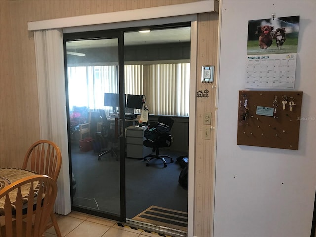 office space with light tile patterned flooring