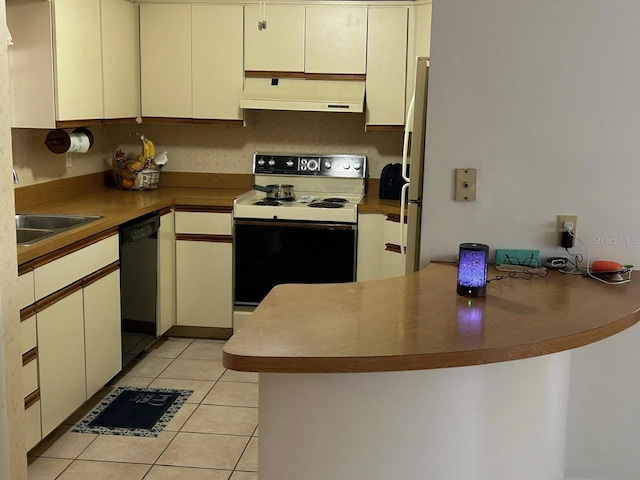 kitchen with a peninsula, under cabinet range hood, light tile patterned flooring, dishwasher, and range with electric stovetop