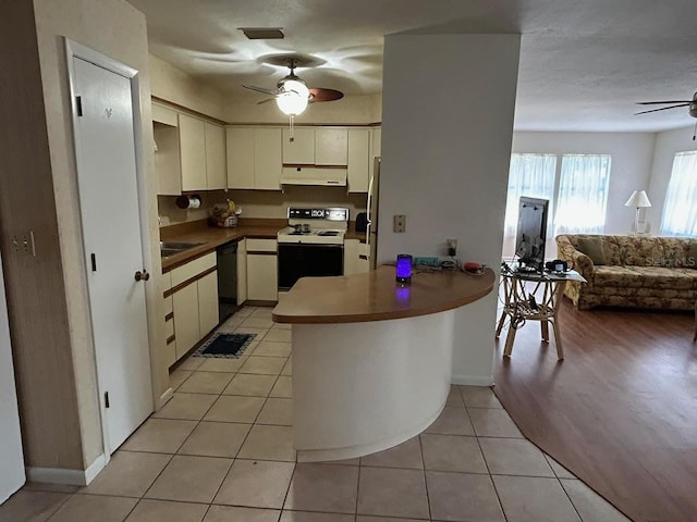 kitchen featuring white electric range oven, a peninsula, a ceiling fan, under cabinet range hood, and dishwasher