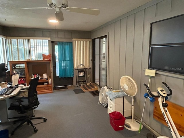 home office with carpet floors and ceiling fan