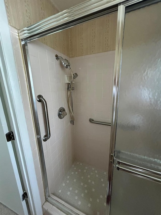 full bathroom with a stall shower