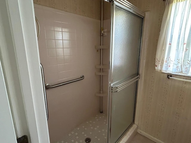 full bath with a shower stall