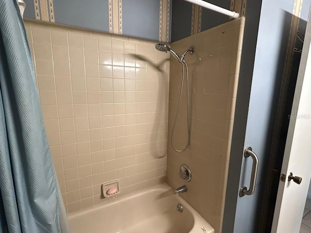 bathroom featuring shower / bath combo with shower curtain