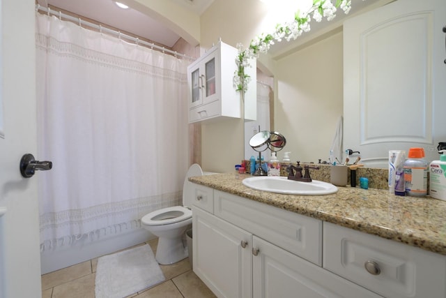 full bathroom featuring vanity, toilet, and tile patterned floors