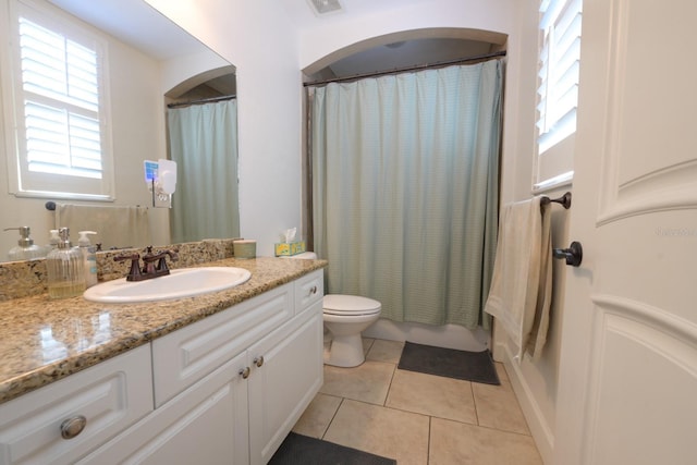 bathroom featuring visible vents, toilet, tile patterned flooring, shower / bathtub combination with curtain, and vanity