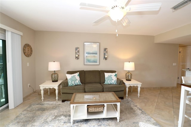 living room with visible vents, a ceiling fan, and light tile patterned flooring