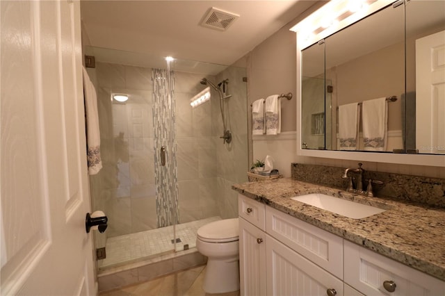 full bath with visible vents, toilet, tile patterned floors, vanity, and a shower stall