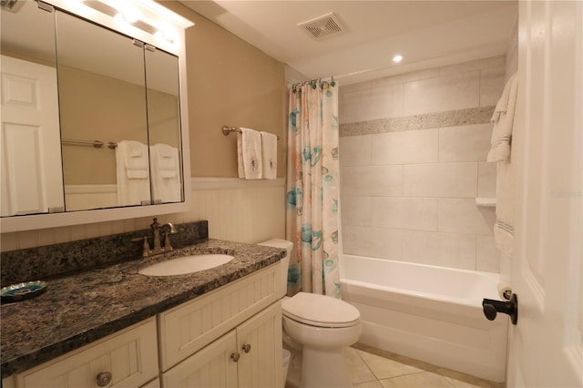 bathroom with shower / tub combo, visible vents, toilet, tile patterned flooring, and vanity