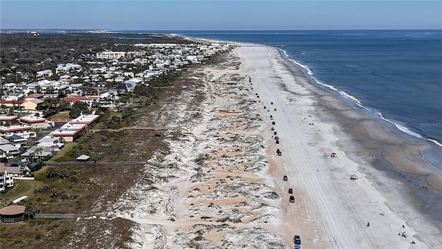 bird's eye view with a water view and a beach view