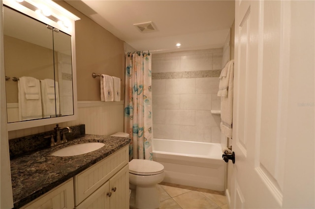 full bath featuring toilet, tile patterned floors, visible vents, vanity, and shower / tub combo with curtain