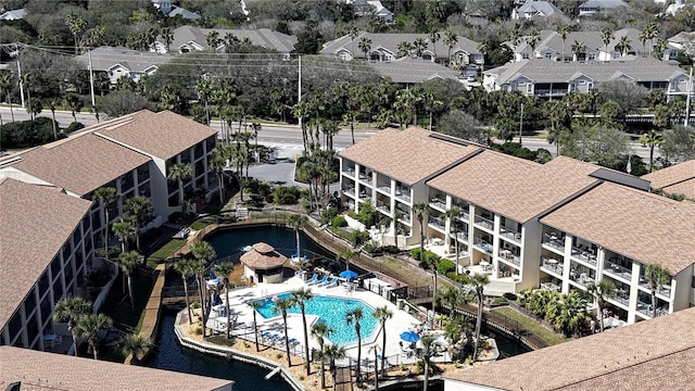 aerial view featuring a residential view and a water view