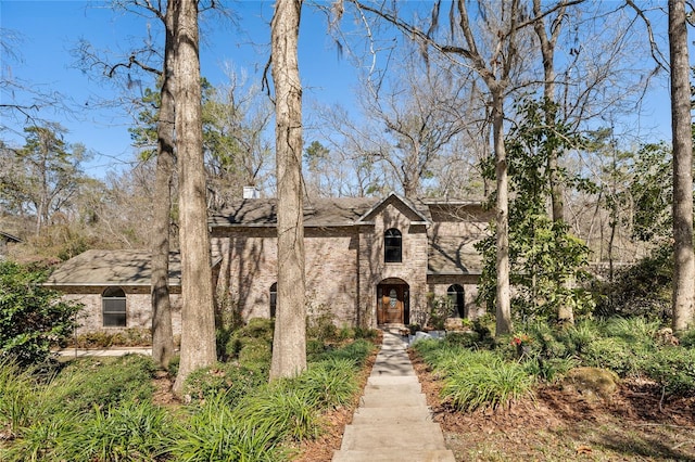 view of front facade with stone siding and brick siding