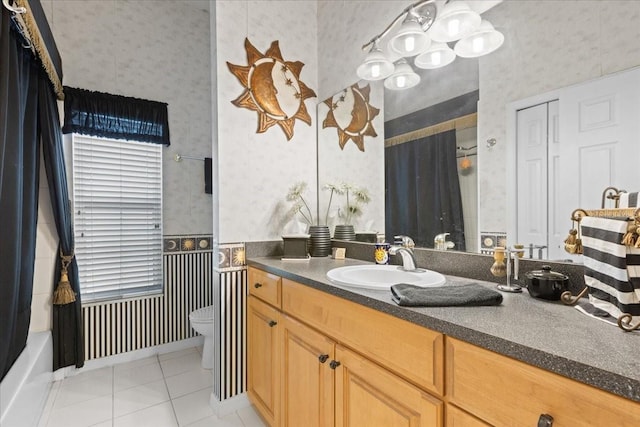 full bath featuring toilet, wallpapered walls, tile patterned flooring, and vanity