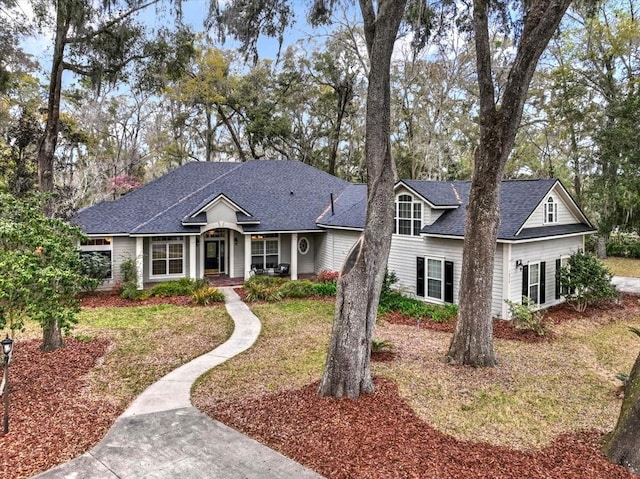 view of front of property with roof with shingles