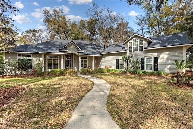 view of front of property with a front lawn