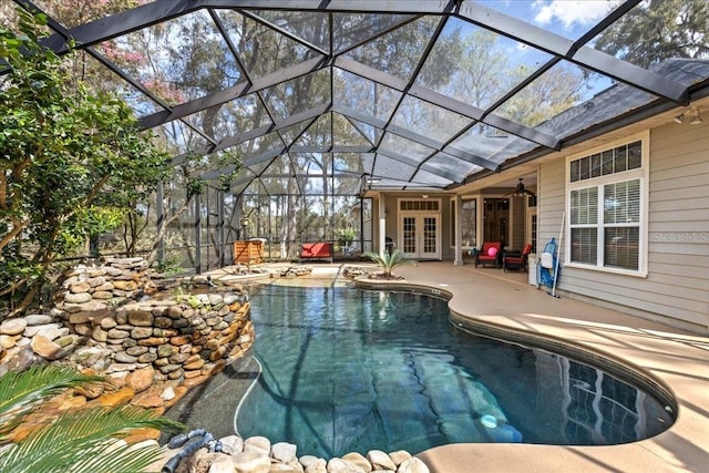 outdoor pool featuring a patio, french doors, a lanai, and a ceiling fan