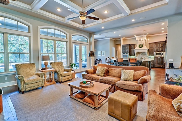 living room with plenty of natural light, wood finished floors, and french doors