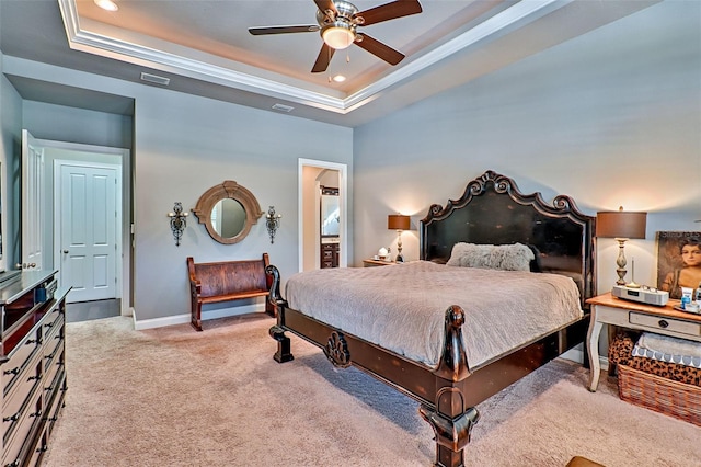 bedroom featuring carpet, visible vents, a tray ceiling, and baseboards