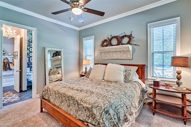 carpeted bedroom featuring ceiling fan, ornamental molding, and multiple windows