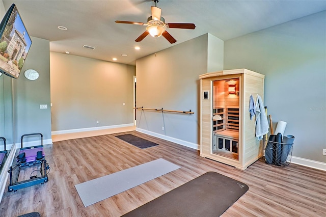 workout area featuring recessed lighting, visible vents, ceiling fan, wood finished floors, and baseboards