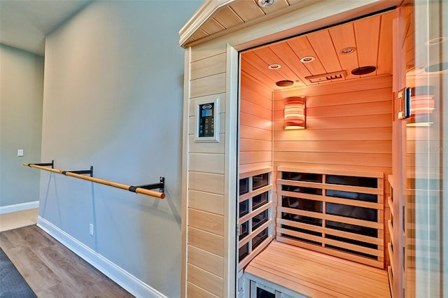 view of sauna with recessed lighting, baseboards, and wood finished floors