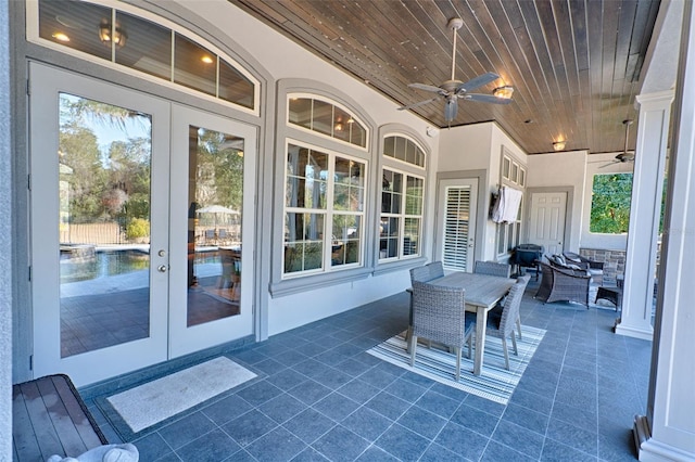 view of patio / terrace featuring a ceiling fan and french doors