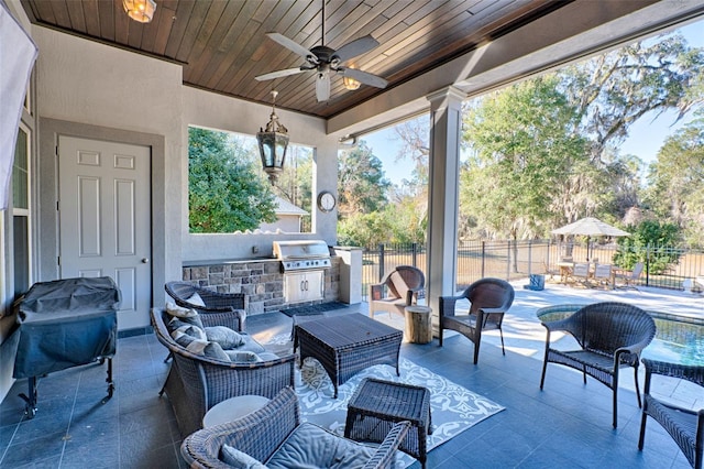 view of patio / terrace with fence, outdoor lounge area, a ceiling fan, and area for grilling