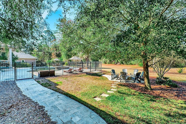 view of yard with a patio and fence