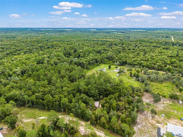 aerial view featuring a view of trees