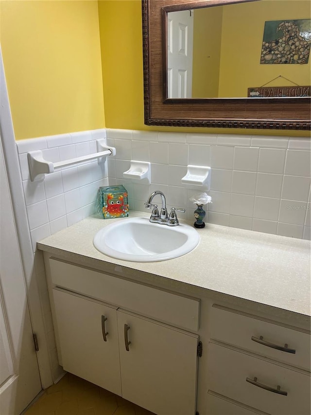 bathroom featuring a wainscoted wall and vanity