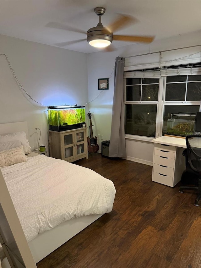 bedroom featuring wood finished floors and a ceiling fan