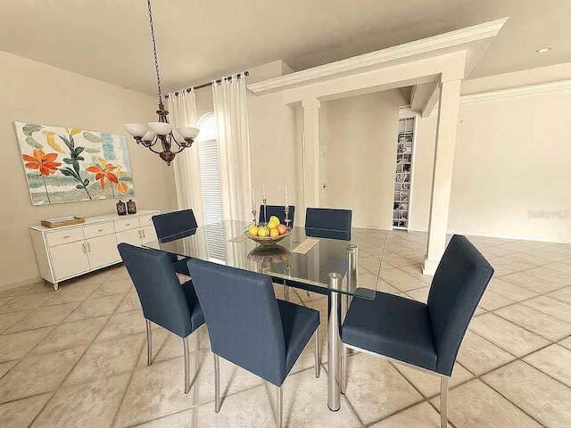 dining room featuring a notable chandelier, baseboards, and light tile patterned floors