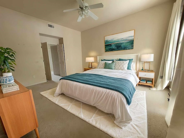 bedroom featuring carpet, visible vents, ceiling fan, and baseboards