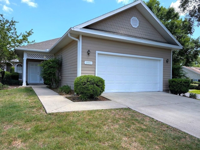 3441 NW 104th Way, Gainesville, FL 32606 - ranch-style house with driveway, a front yard, and a garage
