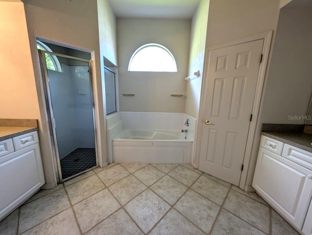 3441 NW 104th Way, Gainesville, FL 32606 - full bathroom featuring vanity, a stall shower, and a garden tub