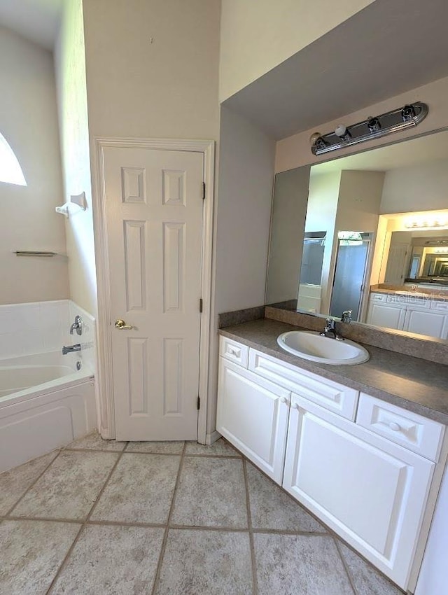3441 NW 104th Way, Gainesville, FL 32606 - full bath featuring tile patterned floors, a shower with door, vanity, and a bath