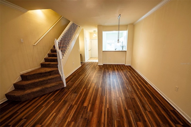 entryway featuring ornamental molding, stairway, dark wood-style flooring, and baseboards