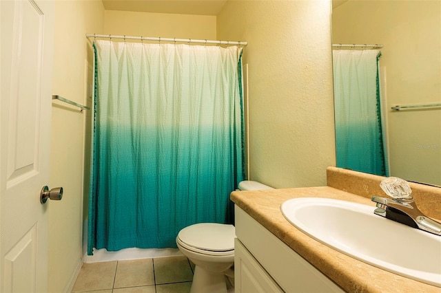 full bath featuring a shower with curtain, vanity, toilet, and tile patterned floors