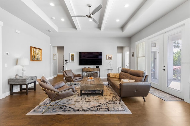 living area featuring french doors, beamed ceiling, wood finished floors, and visible vents