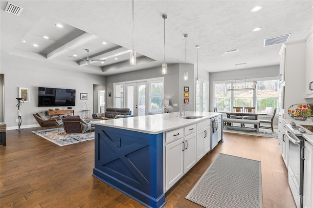 kitchen with electric range, french doors, visible vents, and a sink