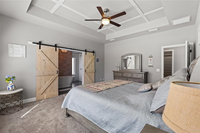 bedroom with baseboards, a tray ceiling, a barn door, carpet flooring, and coffered ceiling