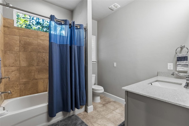 full bathroom featuring vanity, visible vents, baseboards, toilet, and shower / tub combo with curtain