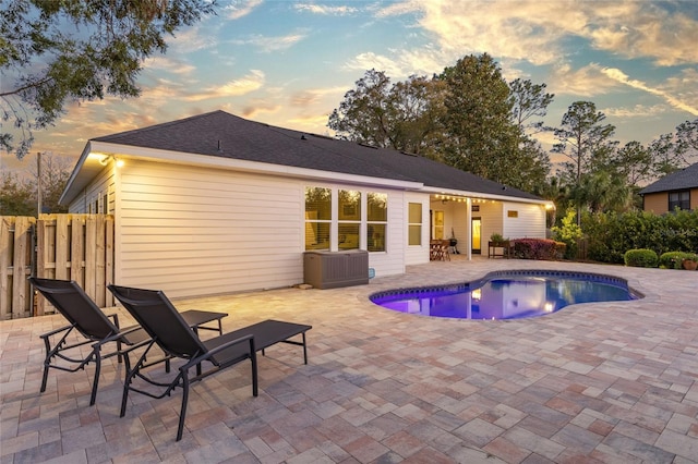 view of pool featuring a patio area, a fenced in pool, and fence