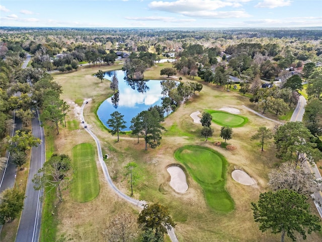 birds eye view of property featuring golf course view and a water view