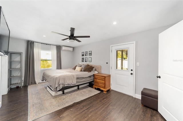 bedroom with recessed lighting, dark wood-type flooring, an AC wall unit, ceiling fan, and baseboards