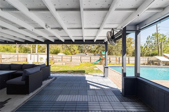 view of patio / terrace with a fenced in pool, a playground, and a fenced backyard