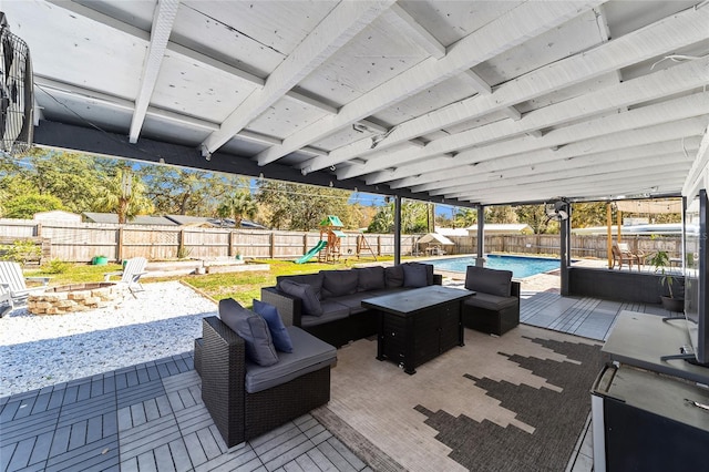 view of patio with a fenced in pool, an outdoor living space with a fire pit, a playground, and a fenced backyard